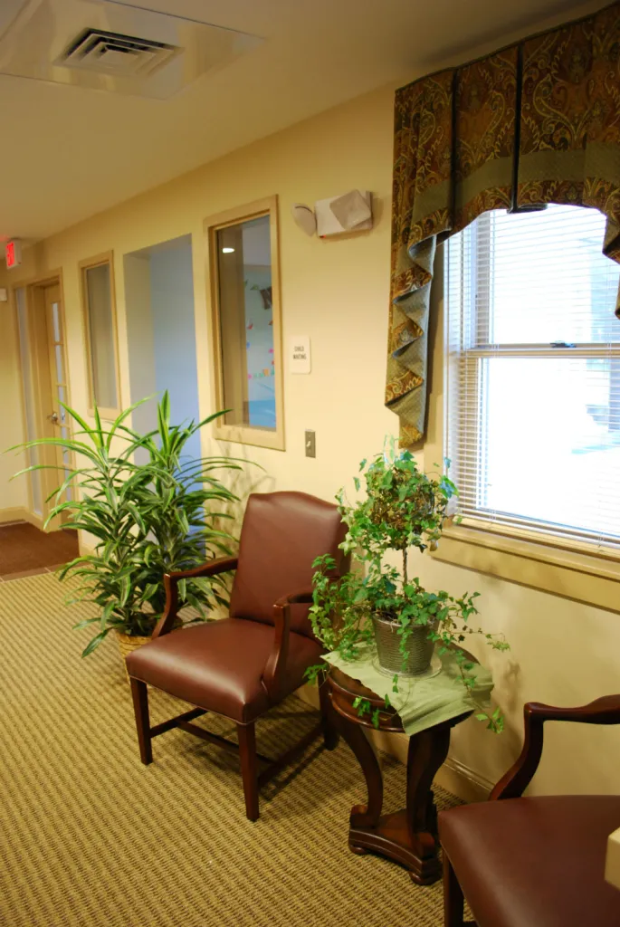 Waiting room with plants and windows