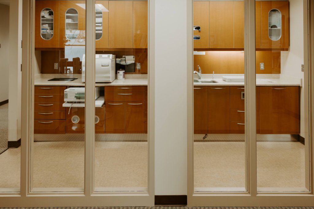 Dental office treatment area with private operatories and modern cabinetry