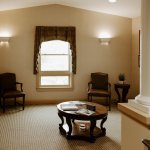 Comfortable dental office waiting room with seating and welcoming décor